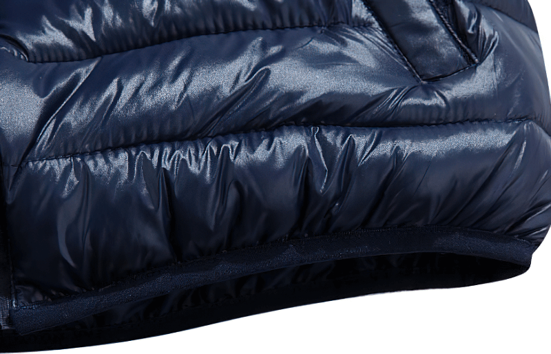 Close-up of navy casual zipper thermal vest for women with a shiny finish and zipper pocket detail.